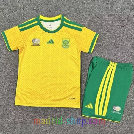 Camiseta Sudáfrica Primera Equipación 2026 Niño amarillo con pantalón corto verde.