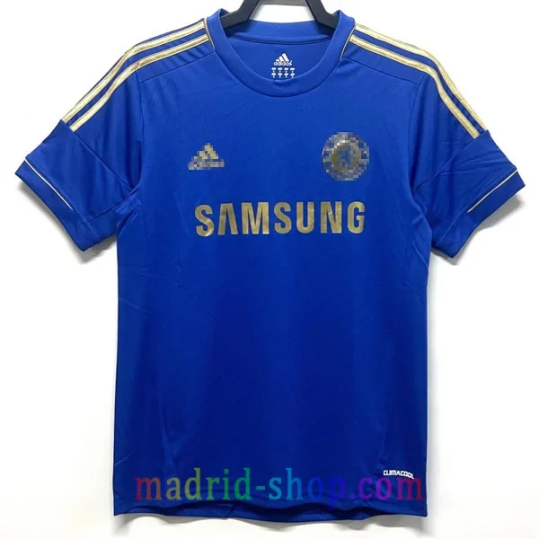 Camiseta Chelsea Primera Equipación 2012-13 Camiseta Chelsea Primera Equipación 2012-13 Retro azul con detalles y publicidad de Samsung en color oro.