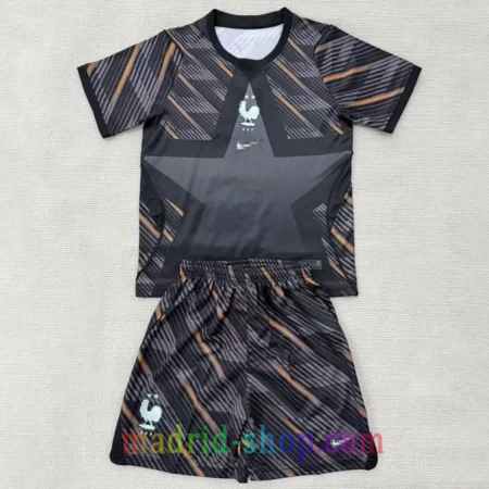 Camiseta de Portero Francia 2026 Niño negra y bronce con conjunto de pantalón corto.