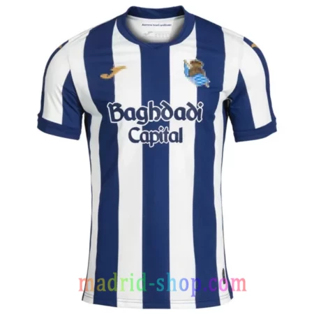 Camiseta Real Sociedad Primera Equipación 2026-27 blanquiazul con logotipos en color oro.