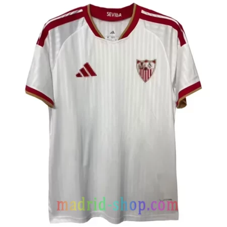Camiseta Sevilla Primera Equipación 2026-27 blanca con detalles rojos y ribete dorado.