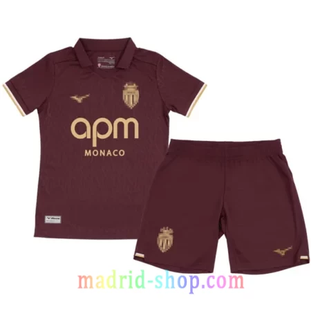 Camiseta AS Monaco Niño Segunda Equipación 2026-27 conjunto infantil marron uva con pantalon corto.