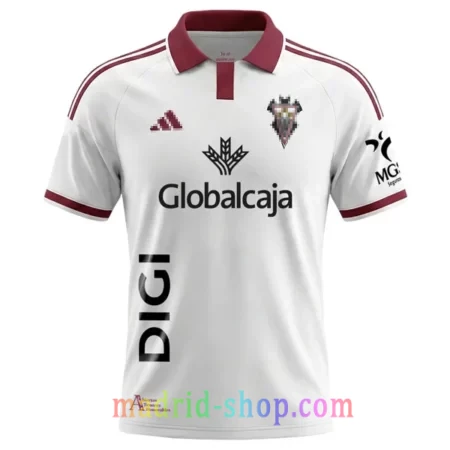 Camiseta Albacete Balompié Primera Equipación 2026-27 blanca con cuello polo rojo y lema.