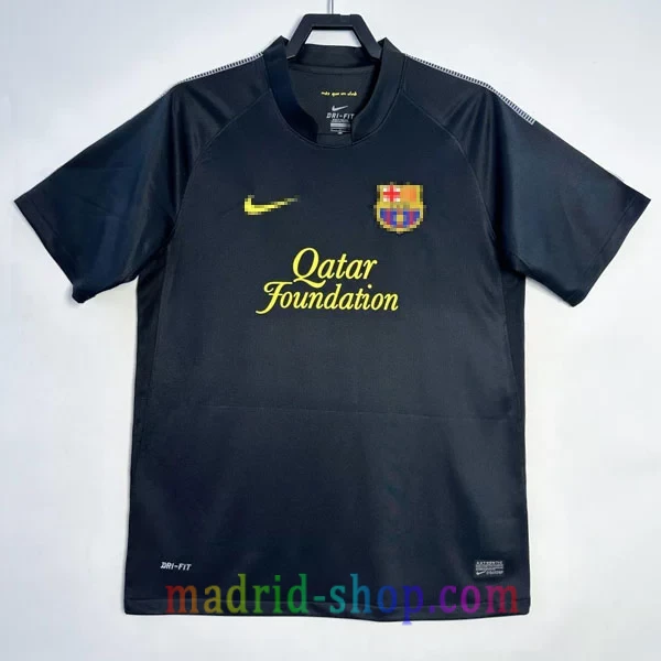 Camiseta Barcelona Segunda Equipación 2011-12 Camiseta Barcelona Segunda Equipación 2011-12 Retro negra con detalles amarillos.